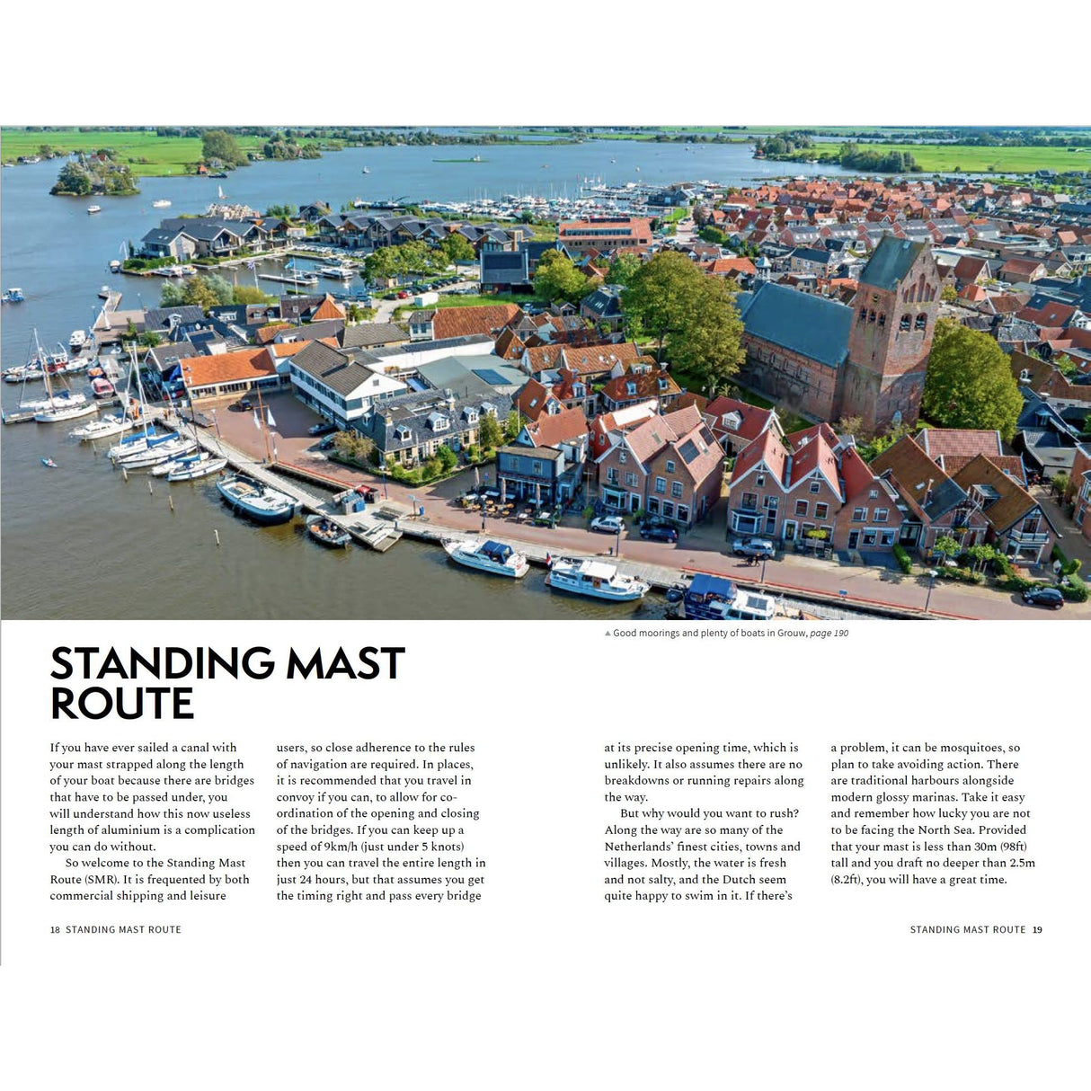 Aerial view of a Dutch harbor town on the Standing Mast Route, with boats, classic houses, and green fields—a perfect cover for the Adlard Coles Shore Guide: The Netherlands by Adlard Coles.