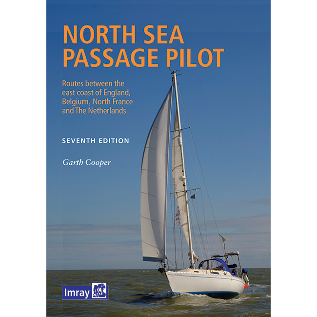 The cover of Imray's "North Sea Passage Pilot," Seventh Edition by Garth Cooper, showcases a sailboat amidst calm seas with windfarms and a blue sky, detailing routes between England's east coast, Belgium, Northern France, and The Netherlands.