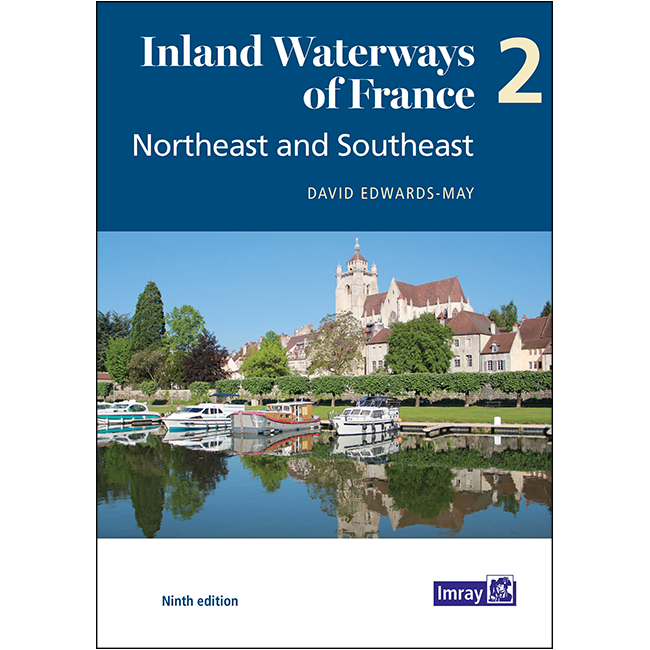 Cover of "Inland Waterways of France Volume 2: Northeast and Southeast" by Imray, Ninth edition. The image depicts a scenic French riverside with boats, lush greenery, historic buildings, and a blue sky.