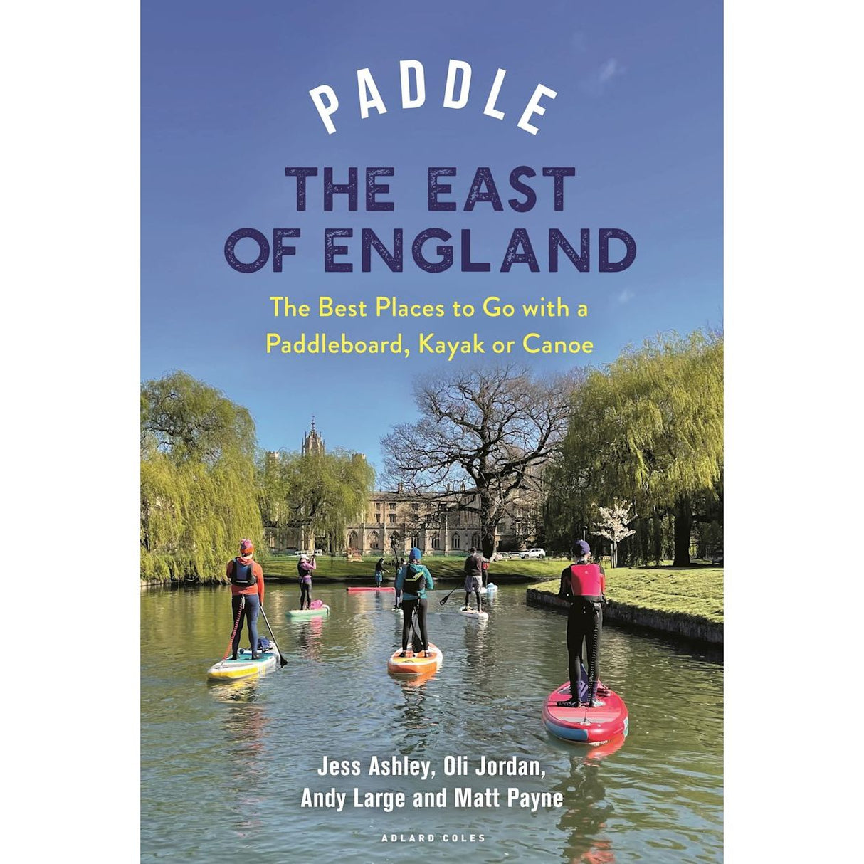 The cover of "Paddle the East of England" by Adlard Coles shows paddleboarders on a calm river in the Norfolk Broads, surrounded by lush greenery and an old building, with the title and brand name prominently displayed.
