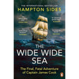 The Penguin Books cover for "The Wide Wide Sea" by Hampton Sides showcases an old sailing ship, similar to the HMS Resolution, navigating a stormy sea. Features quotes from The Sunday Times, Telegraph, Economist, and Spectator with the Penguin logo at the bottom.