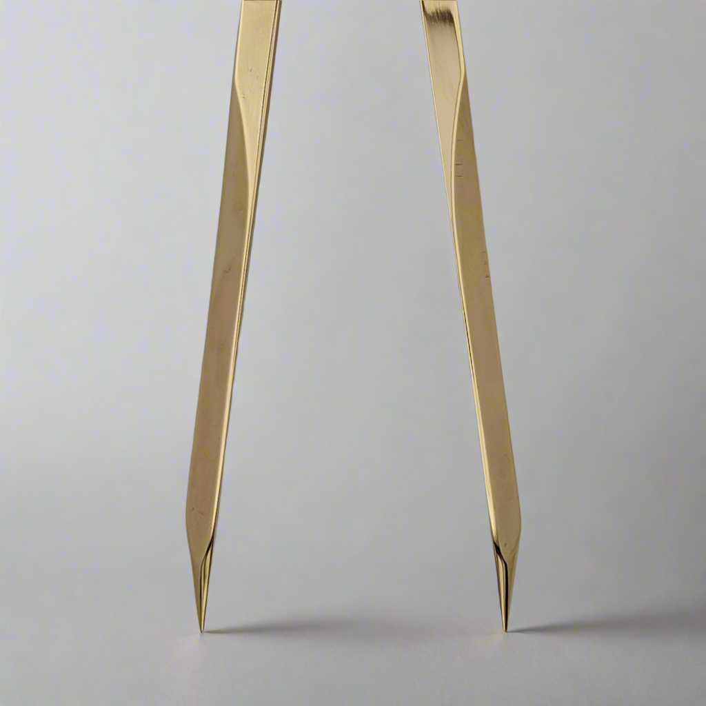Close-up view of the Chartwright 7" Straight Brass Dividers, a precision instrument by Chartwright with its tips inserted into a white surface. The legs of the dividers are slightly angled, showcasing the precision points used for chart work and drawing circles. The background is plain and softly blurred.