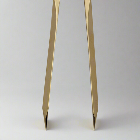 Close-up of the pointed ends of the Chartwright 8" Straight Brass Dividers against a plain, light background. The tips are sharp and angled, extending downward slightly apart from each other, showcasing this precision instrument's craftsmanship from Chartwright.