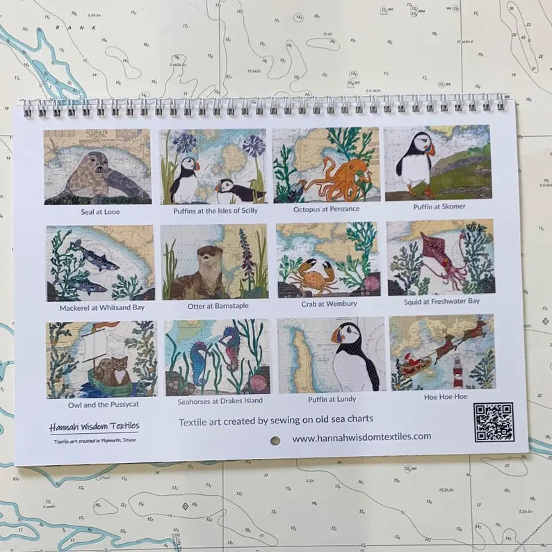 The Hannah Wisdom Textiles Coastal Calendar 2026 features twelve textile art illustrations of coastal animals and scenes, each marked with a location, set against a nautical map background.