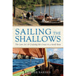 Cover of *Sailing the Shallows* by Adlard Coles: The top half illustrates people near boats on a rocky shore, celebrating small boat sailing. The bottom half shows a deck view with sails and coastline. Subheading: "The Lost Art of Cruising the Coast in a Small Boat.