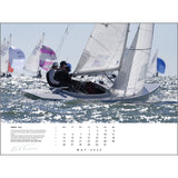 Participants maneuver through the ocean in an exhilarating sailboat race, their sails capturing the wind perfectly. Overlaid with a May 2025 schedule, this vibrant image exemplifies the artistry seen in sailing photography, evoking the timeless appeal of a Rick Tomlinson Portfolio Calendar 2025 piece by Rick Tomlinson Photography.