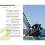 A group of individuals maneuvers a large yacht in crystal-clear waters beneath a sunny sky. The vessel tilts as crew members adjust the sails, epitomizing the sailing mindset. This imagery is featured in an article about Adlard Coles' "The Psychology of Sailing for Dinghies and Keelboats," which explores the psychology behind sailboat racing.