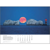 A large pink full moon rises between two sea stacks and a red-striped lighthouse, illuminating the calm ocean for the Rick Tomlinson Portfolio Calendar 2026 by Rick Tomlinson Photography, January.
