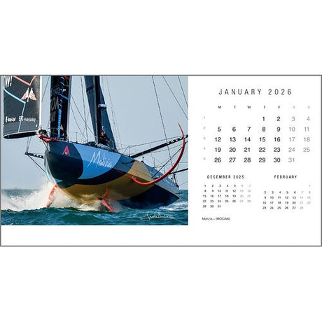 A racing sailboat marked “Malizia” skims ocean waves, featured in Rick Tomlinson’s yachting photography. On the right, the Rick Tomlinson Desk Calendar 2026 by Rick Tomlinson Photography displays January with previews of nearby months.