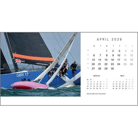 The Rick Tomlinson Desk Calendar 2026 by Rick Tomlinson Photography features striking yachting photos, including April’s image of GBR 1747 capsized as rival crew members lean out over the water under full sail.