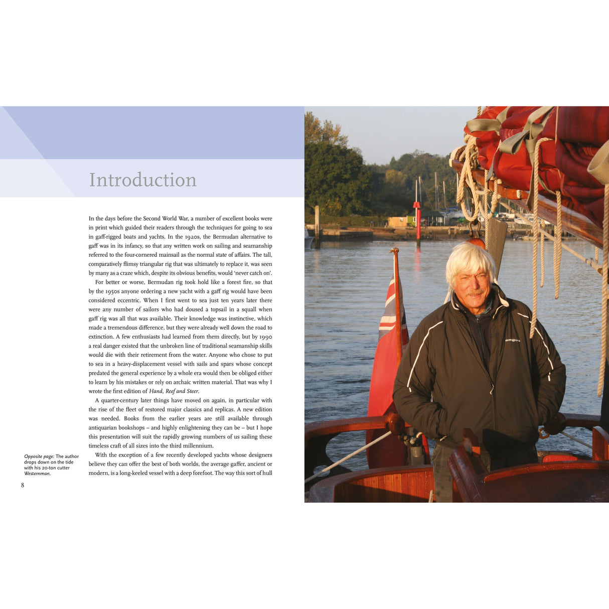 On a calm river, a white-haired man in a dark jacket stands on a gaff rig boat. The left page features an article titled "Introduction," celebrating classic boats and traditional sailing skills, from the book "Hand, Reef and Steer" by Adlard Coles.