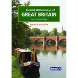 Cover of the book "Inland Waterways Of Great Britain" by Jane Cumberlidge, Eighth Edition. The image features a narrowboat on a tranquil canal lined with trees and a brick bridge in the background. The Imray logo is positioned at the bottom right corner.