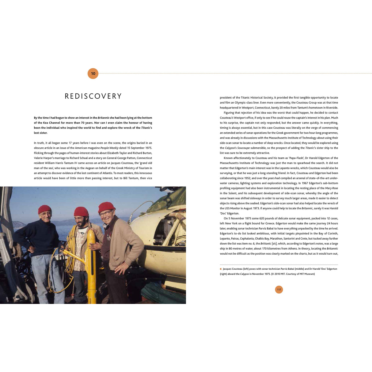 Three people are posed on a ship deck, two of them holding a model of a boat. They are wearing red hats and warm clothing. The page is titled "Exploring the Britannic," highlighting Adlard Coles' efforts in shipwreck exploration, reminiscent of Jacques Cousteau’s storied adventures.