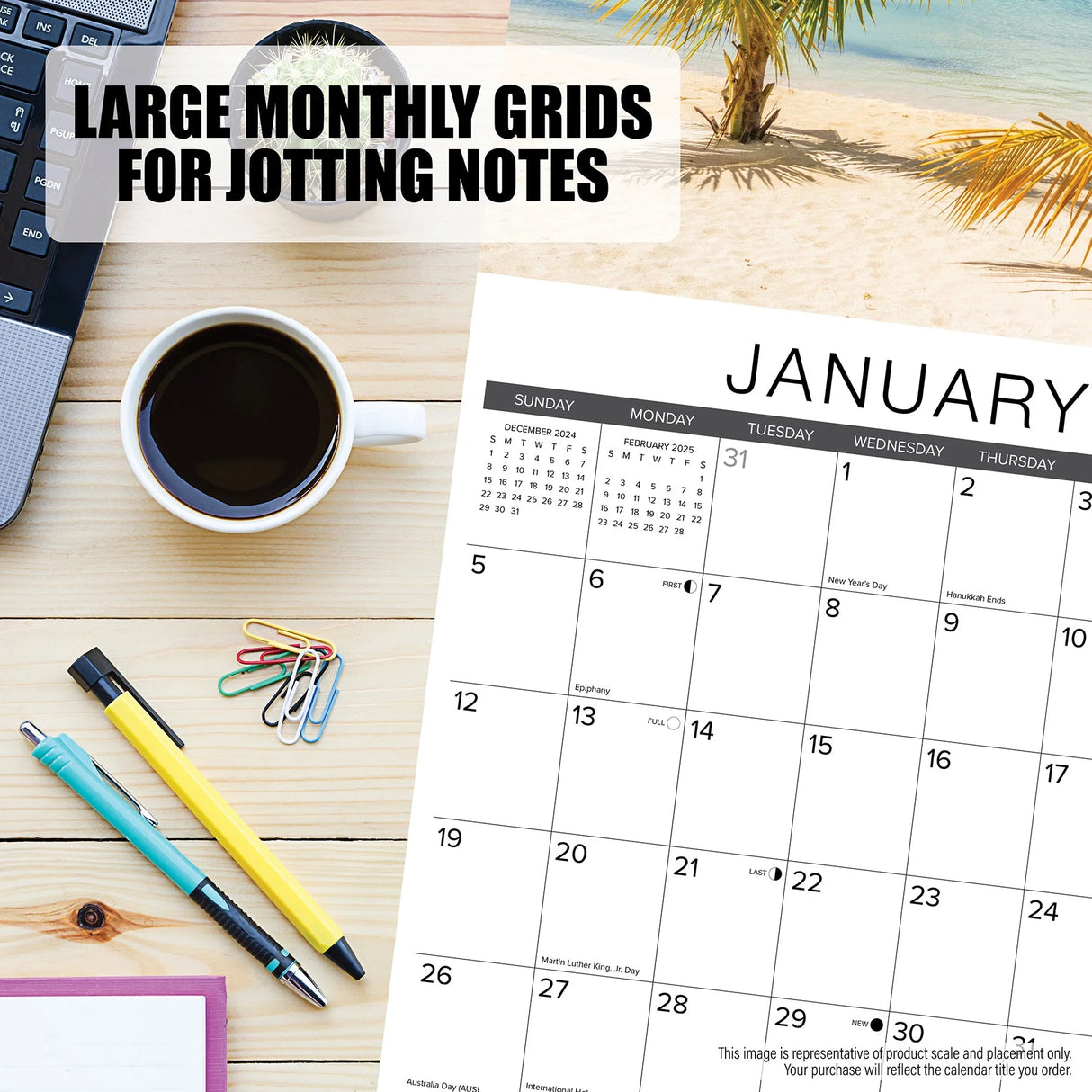 On a desk with a Willow Creek Press coffee mug, laptop, pens, and paperclips, the Willow Creek Tall Ships 2025 Calendar is opened to January showcasing large grids for notes with a palm tree and beach scene in the background.