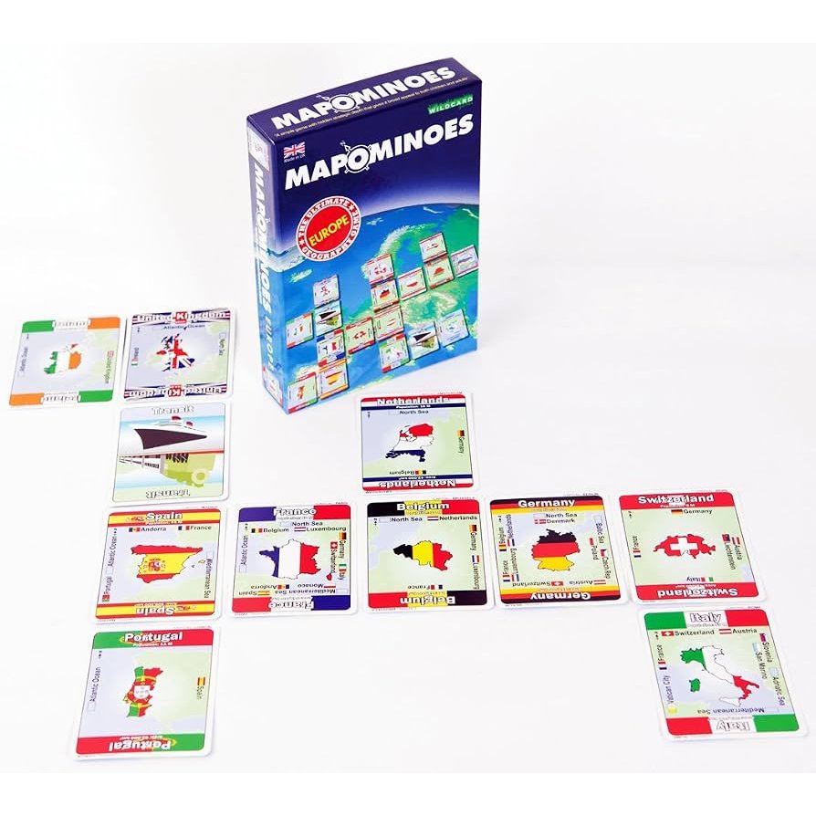 A Mapominoes Europe geography game box with scattered playing cards displaying maps, country names, and the national flags of European countries.