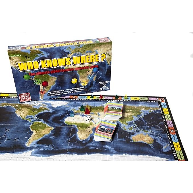 The Who Knows Where? board game displayed with its world map board, playing cards, colored player tokens, dice, and game box.