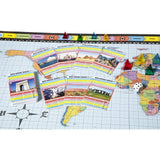 The Who Knows Where? board game features a world map board, decks of geography trivia cards, a die, and translucent plastic player tokens designed to help players learn about our world.