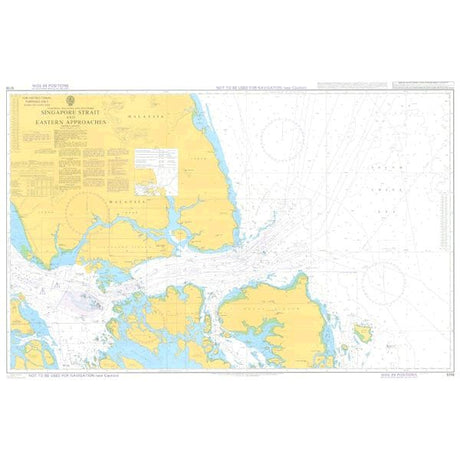 The Admiralty Instructional Chart 5118 for Singapore Strait and its Eastern Approaches is a nautical chart that complies with SOLAS regulations. It accurately displays water depths, navigational hazards, commercial shipping routes, and land areas in yellow. Labels, coordinates, and various nautical symbols are detailed throughout this Admiralty Standard Nautical Chart.