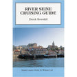 The cover of the "River Seine Cruising Guide" by Derek Bowskill, published by Imray, showcases a picturesque riverside village adorned with historical buildings and a church, all reflected in the serene waters of the Seine under a blue sky. This book is perfect for those exploring French inland waterways.