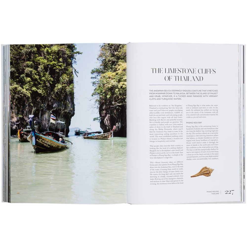 An open book, "Sailing the Seas" by gestalten, displays a scenic image of long-tail boats in turquoise water with limestone cliffs and greenery in Thailand. The opposite page, titled "The Limestone Cliffs of Thailand," features a small shell illustration hinting at nautical adventures.