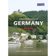 Cover of the book "Inland Waterways of Germany" by Barry Sheffield, published by Imray. The cover depicts a picturesque riverside village surrounded by green hills with a castle on top. Boats are docked along the river, illustrating the enchanting German waterway system. The book is labeled as a revised first edition.