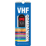 The "VHF Companion" by Fernhurst Books is a spiral-bound guidebook with a VHF radio cover and colorful numbered contents, serving as an essential reference for radio call and DSC procedures.