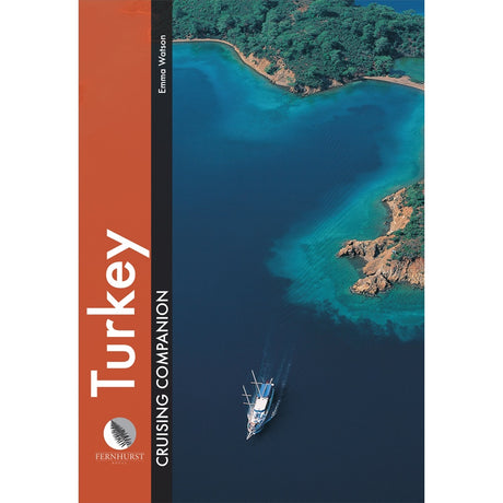 A yacht sails along Turkey’s lush coastline in the cover image of “Turkey Cruising Companion,” an essential guide from Fernhurst Books.