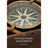 Close-up of an antique compass in a wooden box with a detailed compass rose. Below, white text reads "Navigational Instruments" and "Shire Books," illustrating the progression from classic navigation tools to satellite positioning.