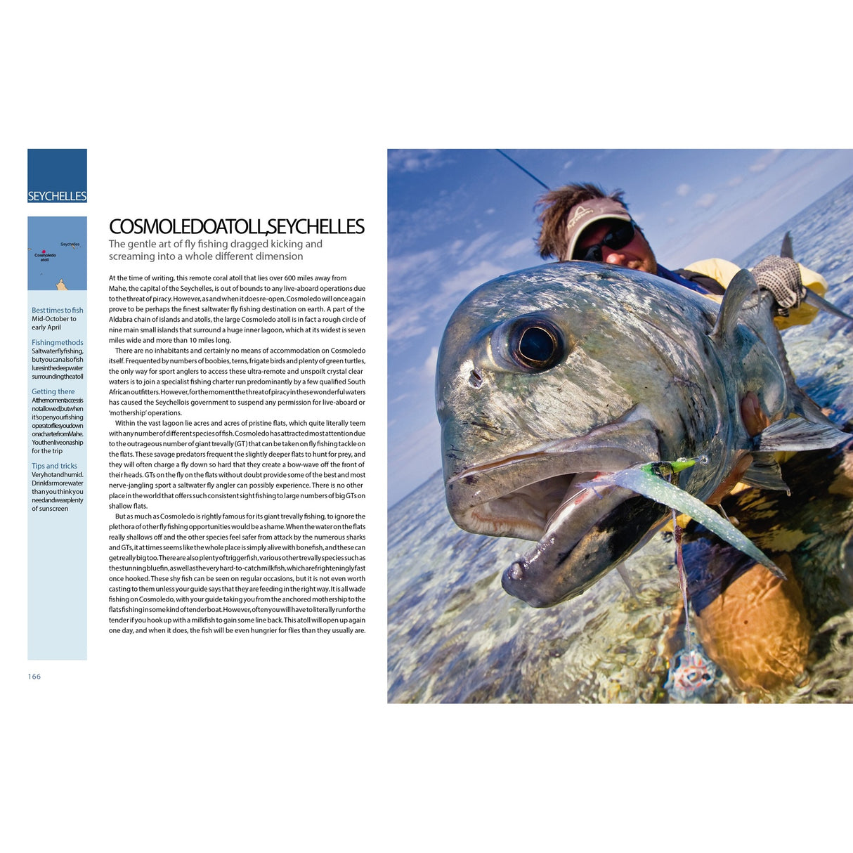 A fly fisher in sunglasses and waders stands in clear water behind a large fish hooked on a lure—a perfect moment from Ultimate Fishing Adventures by Fernhurst Books, captured under a blue sky with scattered clouds.