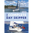 Cover of "The Complete Day Skipper" by Tom Cunliffe, 7th edition, published by Adlard Coles. The image showcases two sailing yachts on open water: one in the top half under a partly cloudy sky near rocky shores, and one in the bottom half with a crew onboard flying a red flag. This scene illustrates the expert yacht handling skills taught by top sailing instructors.