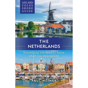 The "Adlard Coles Shore Guide: The Netherlands" by Adlard Coles features Dutch windmills, houses, and marina scenes, offering essential tips for sailing and exploring the Standing Mast Route in the Netherlands.