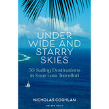 Cover of "Under Wide and Starry Skies" by Adlard Coles, showcasing a tropical sea with a distant sailboat and palm fronds above. Text emphasizes 50 remote anchorages in less-traveled seas.