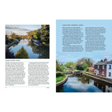 Two pages from "The Great British River" by Bloomsbury show photos and text on English canals: the Grand Union Canal with boats (left) and the Leeds & Liverpool Canal beside a white cottage and blooming trees (right).