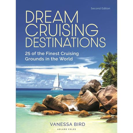 The cover of Adlard Coles' "Dream Cruising Destinations" shows a tropical beach scene with rocks, palm trees, and a sailboat under a clear sky. This second edition sailor's guide by Vanessa Bird highlights 25 cruising grounds for sailing adventures.