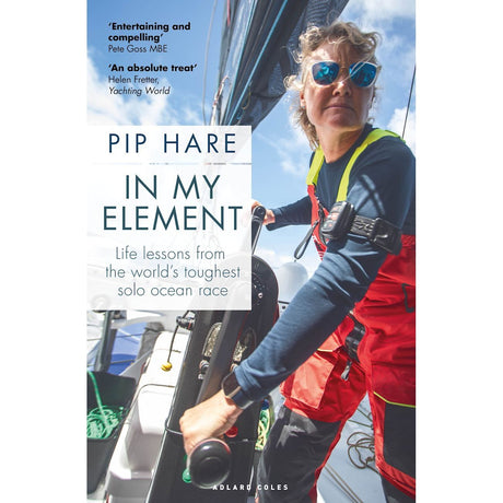 Dressed in red and black gear, a sailor skillfully navigates a sailboat with intense focus. This image embodies the spirit of "In My Element," a book by Adlard Coles, where Pip Hare shares life lessons from her solo ocean race. The book is hailed in reviews as both entertaining and an absolute treat.