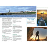 A page from "Paddle the North of England" by Adlard Coles spotlights St Mary’s Lighthouse with info about the area, a coastline photo, and images of paddleboarding—including near the lighthouse and inside a rocky cave.