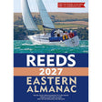 A sailboat on turquoise water with green hills. Text: "Reeds Eastern Almanac 2027 by Reeds—essential for UK east coast cruising, including the Netherlands and Belgium.