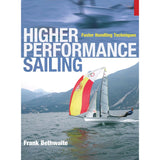 Book cover titled "Higher Performance Sailing" by Adlard Coles. It features a sailboat with vibrant sails navigating the apparent wind on the water, against a mountainous backdrop under a cloudy sky, ideal for those looking to enhance their sailboat racing skills.