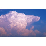 The Cloud Deck by David & Charles features a large, dense cumulus cloud formation with a pink-tinted top standing out against a clear blue sky.
