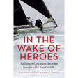 Cover of "In the Wake of Heroes" from Adlard Coles features a photo of a sailor on a large-sailed boat. Introduced by Tom Cunliffe, this yachting classic includes positive feedback from Classic Boat magazine and is published by Bloomsbury.