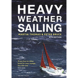 Cover of "Heavy Weather Sailing" by Adlard Coles shows a red-hulled sailboat battling stormy seas, with rough waves and dark skies. The 8th edition features a quote from Pete Goss near the bottom left.