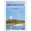 Cover of the book "Irish Sea Pilot" by David Rainsbury, published by Imray. The third edition is a comprehensive cruising guide featuring a sailboat anchored near a sandy shore with a white lighthouse on a grassy hill under a clear blue sky. The subtitle reads, "Cruising the Irish Sea and Isle of Man.