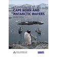 A penguin stands on a rocky shore as two sailboats rest in icy Antarctic waters before snow-capped peaks—a striking cover for Imray’s "Cruising Guide to Cape Horn and Antarctic Waters," with the title and author shown at the top.