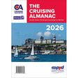 Cover of Imray's "The Cruising Almanac 2026" shows sailboats near ports and marinas, a red and white lighthouse, hillside buildings, and a blue sky. Includes publication details and a professional yacht delivery logo.