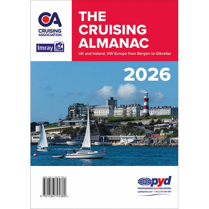 Cover of Imray's "The Cruising Almanac 2026" shows sailboats near ports and marinas, a red and white lighthouse, hillside buildings, and a blue sky. Includes publication details and a professional yacht delivery logo.