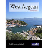 Book cover for "West Aegean" by Rod and Lucinda Heikell, published by Imray, shows a coastal village with white houses, marina boats, blue sea, mountains in the distance, and the Imray logo at the bottom right.