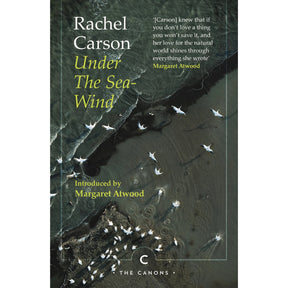 Book cover for Under the Sea-Wind by Rachel Carson, featuring an aerial view of waves meeting a shoreline and a flock of birds, with an introduction and pull quote by Margaret Atwood.