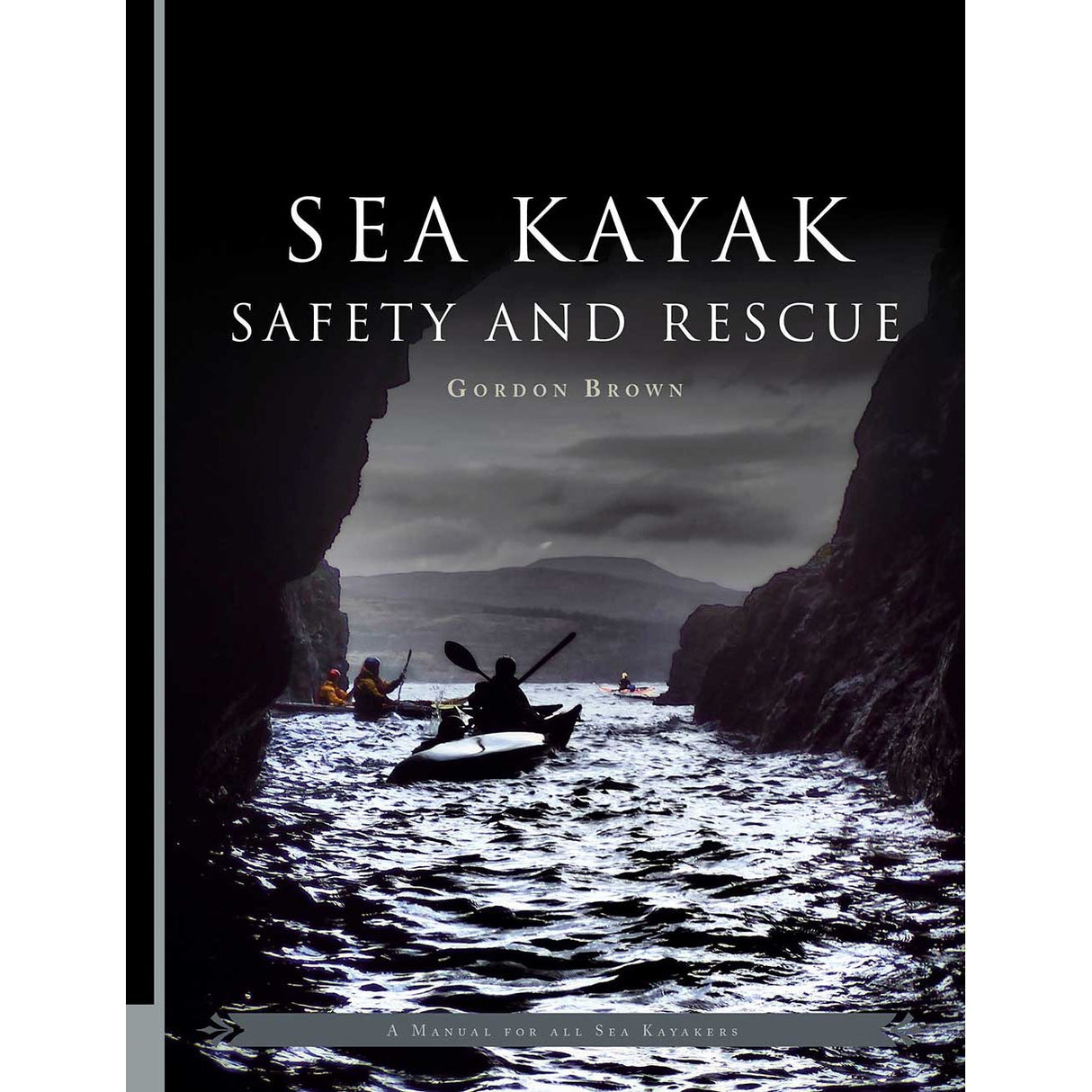 The cover of "Sea Kayak Safety and Rescue" by Pesda Press depicts kayakers navigating waters between dark coastal cliffs under a cloudy sky, reflecting the book’s focus on sea kayak safety and effective kayaking rescue techniques.