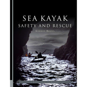 The cover of "Sea Kayak Safety and Rescue" by Pesda Press depicts kayakers navigating waters between dark coastal cliffs under a cloudy sky, reflecting the book’s focus on sea kayak safety and effective kayaking rescue techniques.