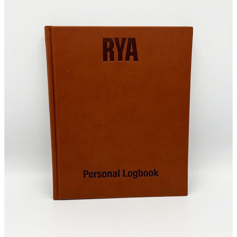 The Royal Yachting Association's RYA Personal Logbook, a brown hardcover, stands upright against a white background—ideal for documenting your journey as a Coastal Skipper or Yachtmaster.